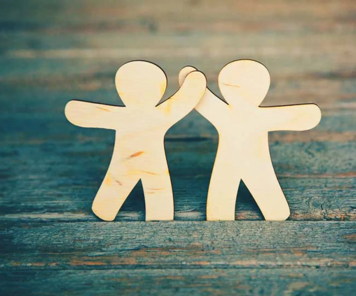 Building Strong Relationships Paper figures holding hands representing healthy relationships