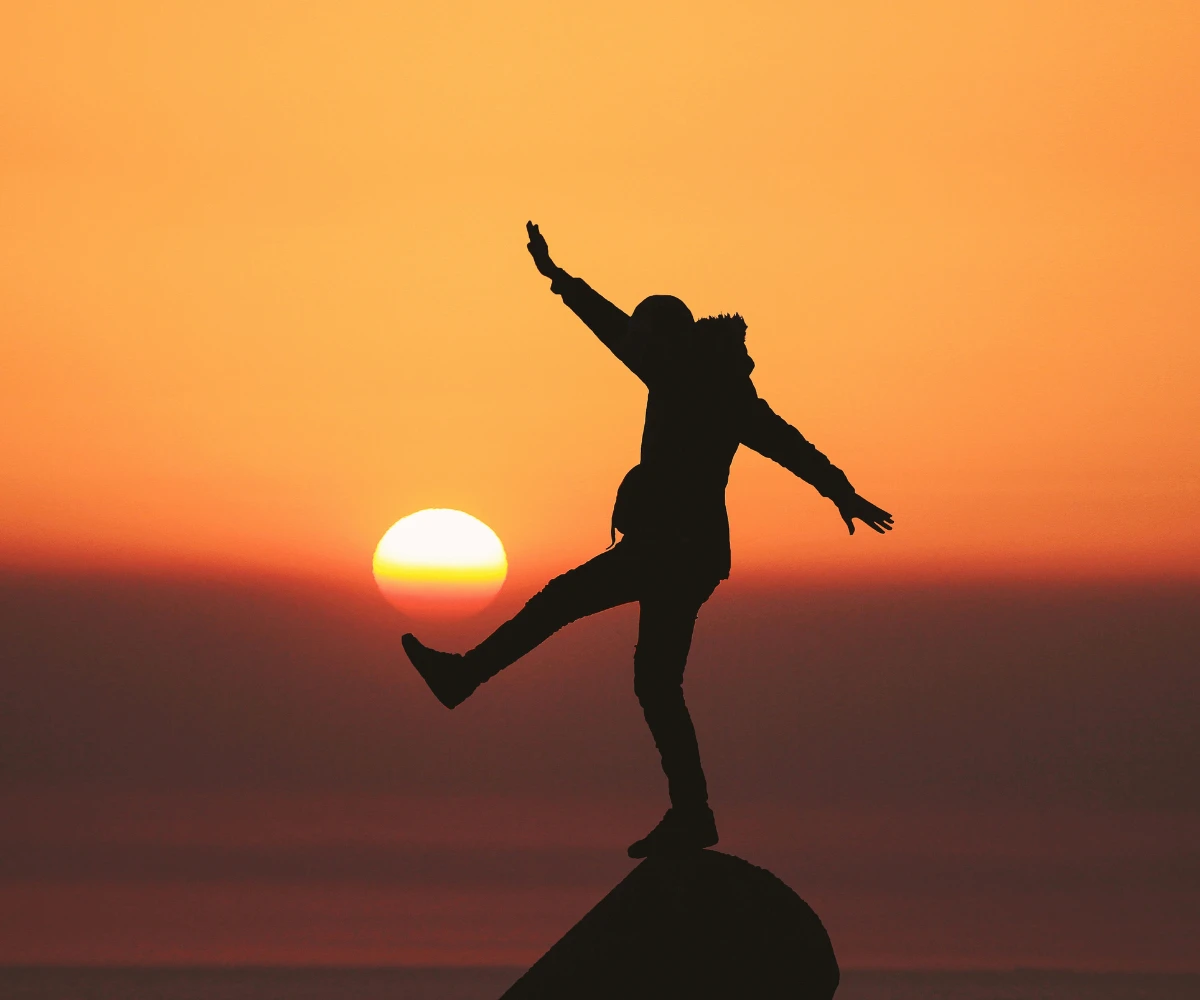 Peaceful Life Balance Person enjoying a peaceful sunset symbolizing balance and inner peace
