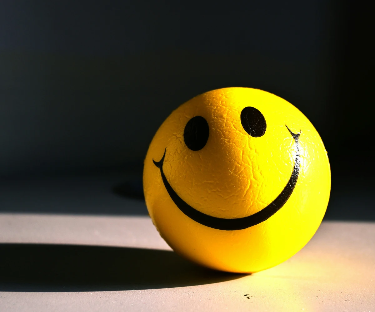 Mental Wellness and Emotional Health Smiley stress ball showing emotional wellbeing and mental wellness